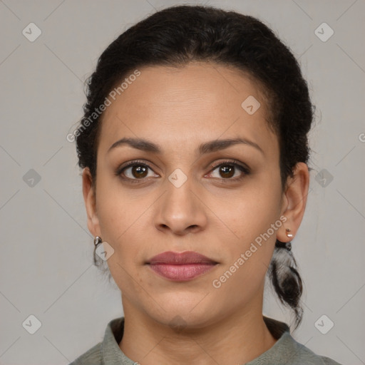 Joyful latino young-adult female with short  brown hair and brown eyes