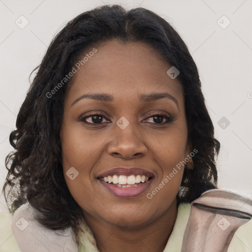 Joyful black young-adult female with long  brown hair and brown eyes