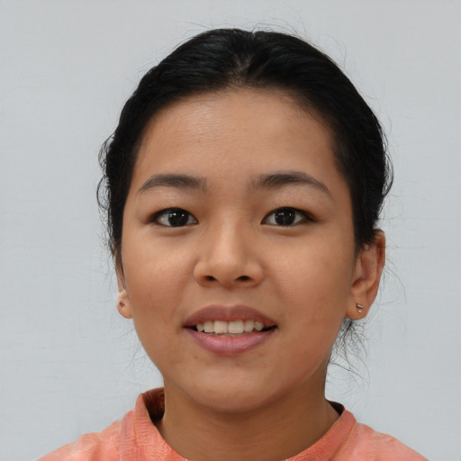 Joyful asian young-adult female with medium  brown hair and brown eyes