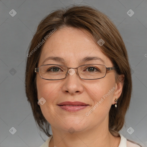 Joyful white adult female with medium  brown hair and grey eyes