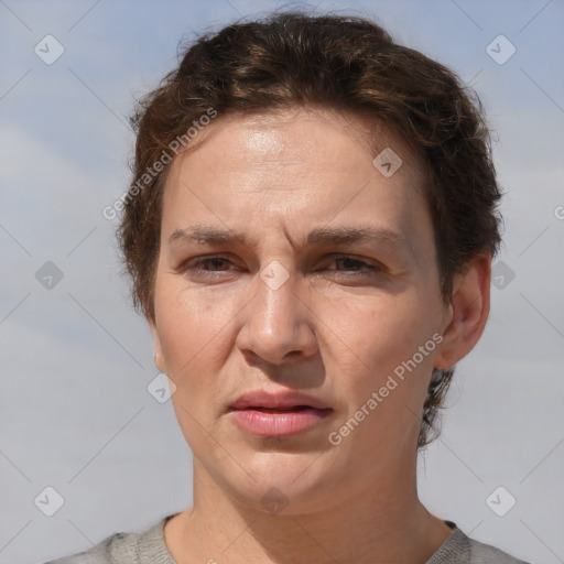 Joyful white adult female with short  brown hair and brown eyes