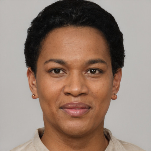 Joyful black adult female with short  black hair and brown eyes