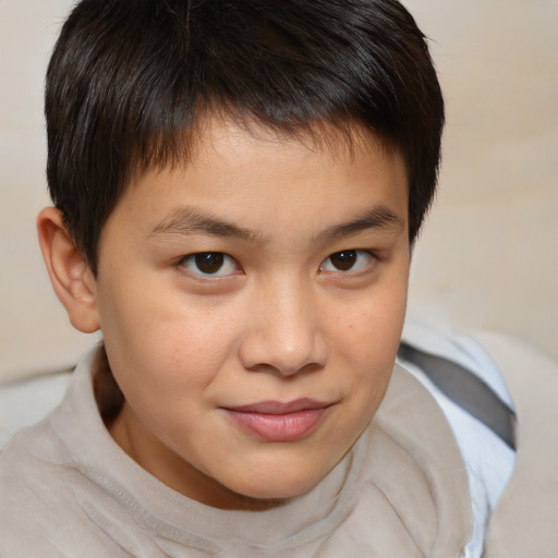 Joyful white child male with medium  brown hair and brown eyes