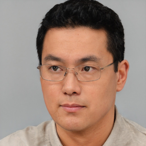 Neutral asian young-adult male with short  black hair and brown eyes