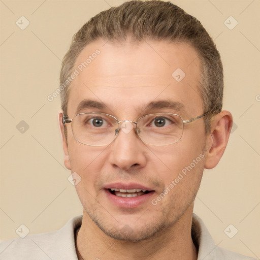 Joyful white adult male with short  brown hair and brown eyes