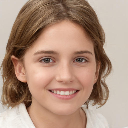 Joyful white child female with medium  brown hair and brown eyes