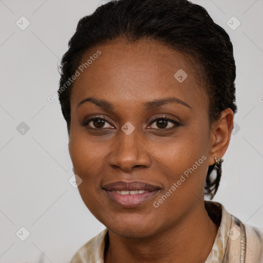 Joyful black young-adult female with short  brown hair and brown eyes