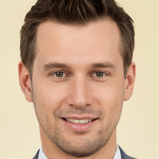 Joyful white young-adult male with short  brown hair and brown eyes