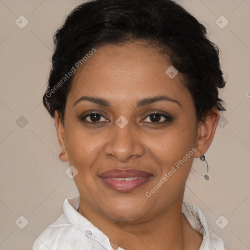 Joyful latino adult female with short  brown hair and brown eyes