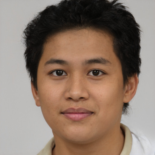 Joyful asian young-adult male with short  brown hair and brown eyes