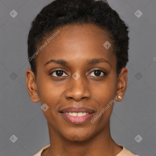 Joyful black young-adult female with short  black hair and brown eyes