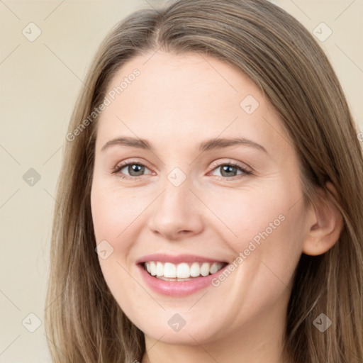 Joyful white young-adult female with long  brown hair and grey eyes