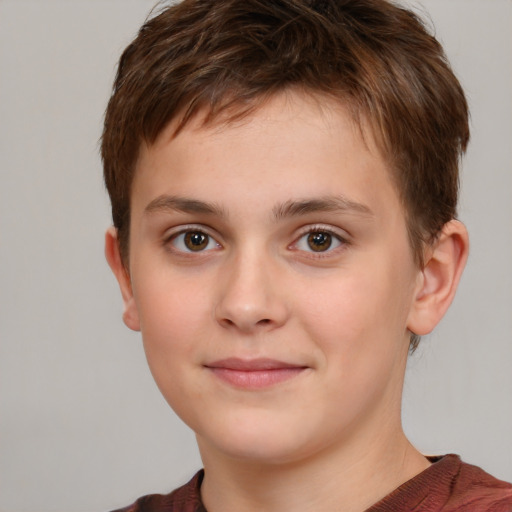 Joyful white child male with short  brown hair and brown eyes