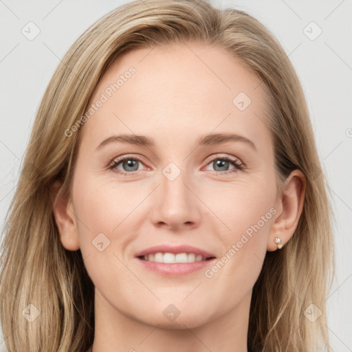 Joyful white young-adult female with long  brown hair and grey eyes