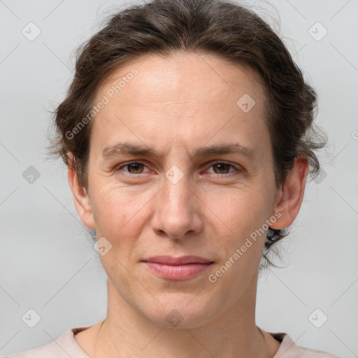 Joyful white adult male with short  brown hair and grey eyes