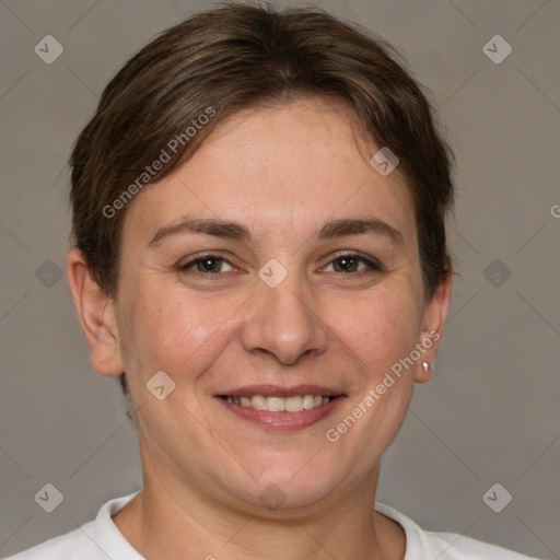 Joyful white adult female with short  brown hair and brown eyes