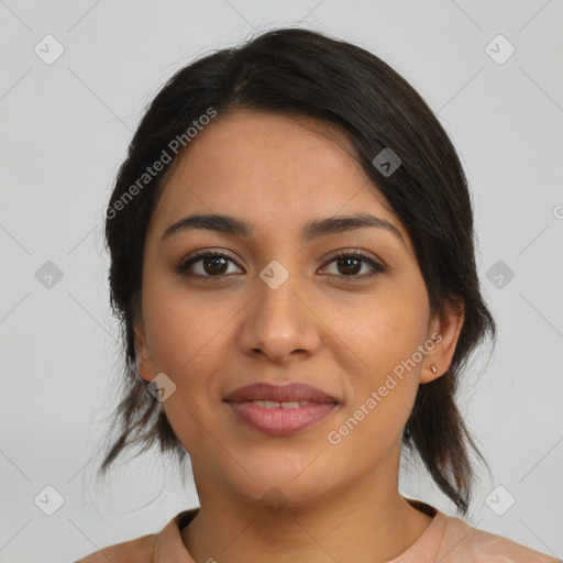 Joyful latino young-adult female with medium  brown hair and brown eyes