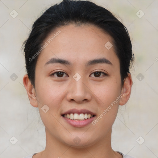 Joyful asian young-adult female with short  brown hair and brown eyes