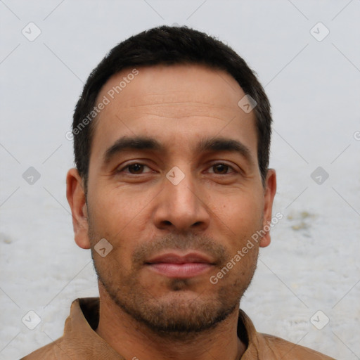 Neutral latino young-adult male with short  black hair and brown eyes