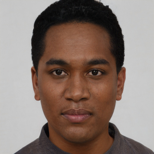 Neutral black young-adult male with short  black hair and brown eyes