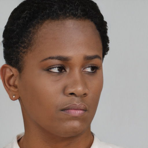 Neutral black young-adult female with short  brown hair and brown eyes