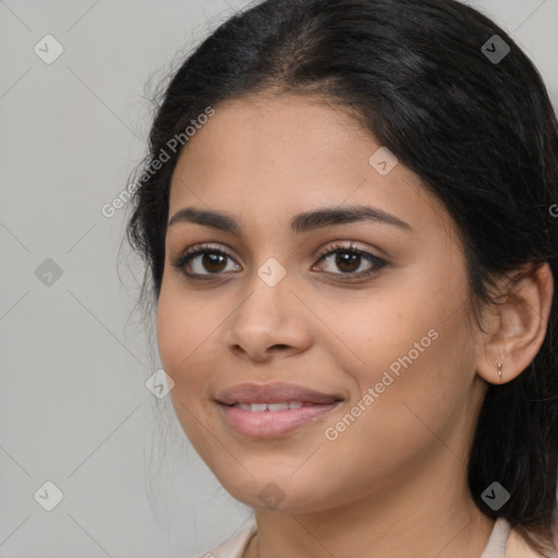 Joyful latino young-adult female with medium  brown hair and brown eyes