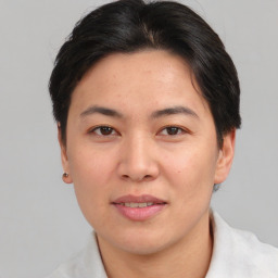 Joyful asian young-adult female with short  brown hair and brown eyes