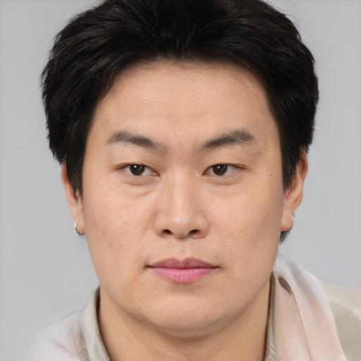 Neutral asian young-adult male with short  brown hair and brown eyes