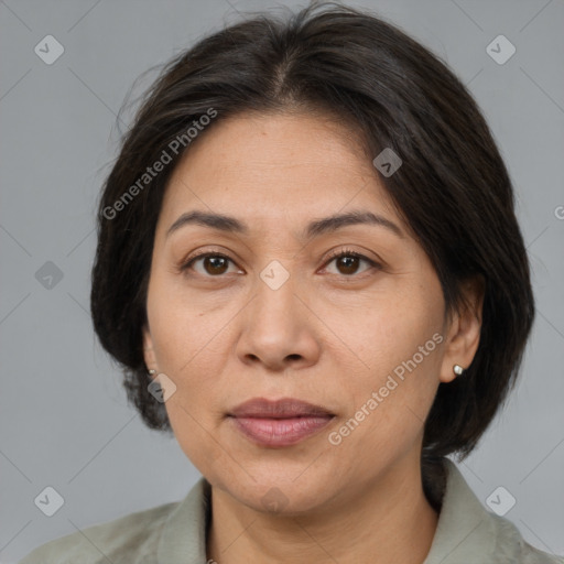 Joyful white adult female with medium  brown hair and brown eyes