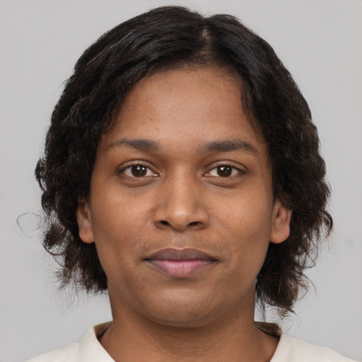 Neutral black young-adult female with medium  brown hair and brown eyes