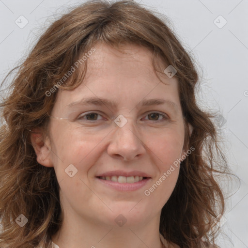 Joyful white adult female with medium  brown hair and grey eyes