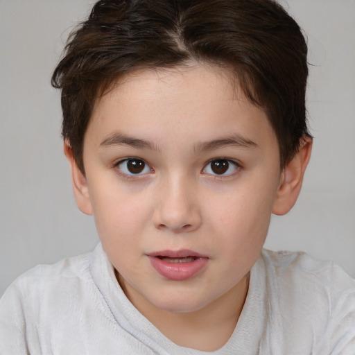 Joyful white child female with short  brown hair and brown eyes
