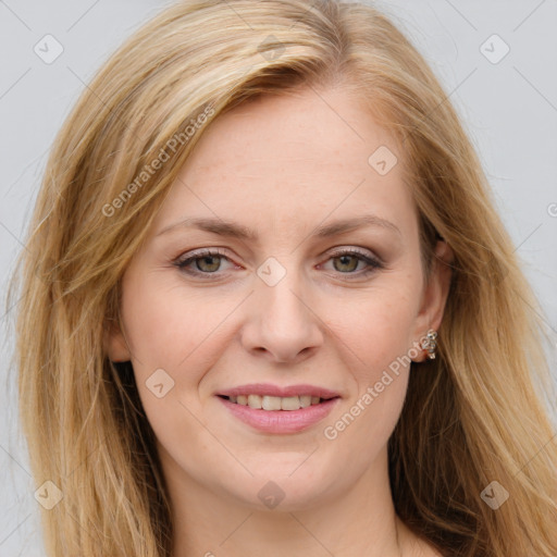 Joyful white young-adult female with long  brown hair and green eyes