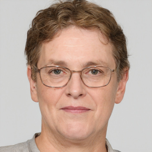 Joyful white middle-aged male with short  brown hair and blue eyes