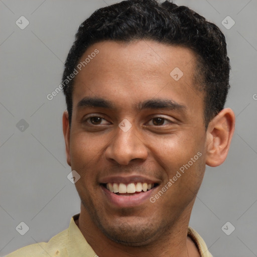 Joyful latino young-adult male with short  brown hair and brown eyes