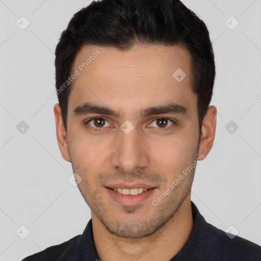 Joyful white young-adult male with short  black hair and brown eyes