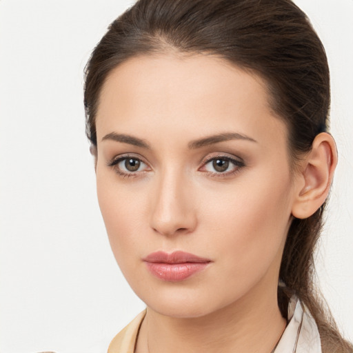 Neutral white young-adult female with long  brown hair and brown eyes