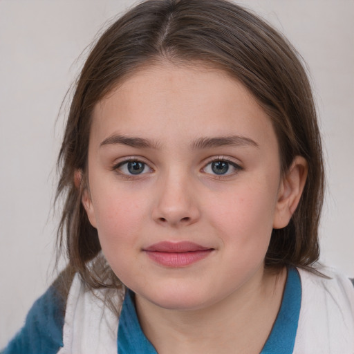 Joyful white child female with medium  brown hair and grey eyes