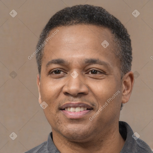 Joyful latino adult male with short  black hair and brown eyes