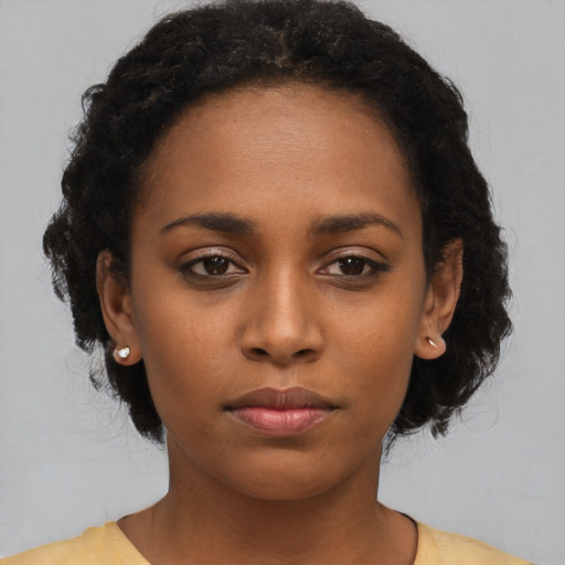 Neutral black young-adult female with short  black hair and brown eyes