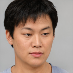 Neutral asian young-adult male with short  brown hair and brown eyes