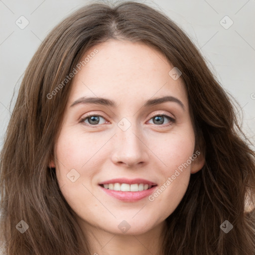 Joyful white young-adult female with long  brown hair and green eyes