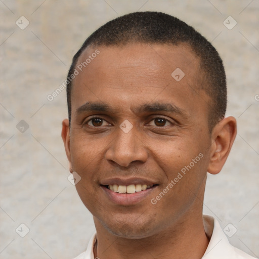 Joyful latino young-adult male with short  brown hair and brown eyes