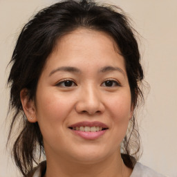 Joyful asian young-adult female with medium  brown hair and brown eyes