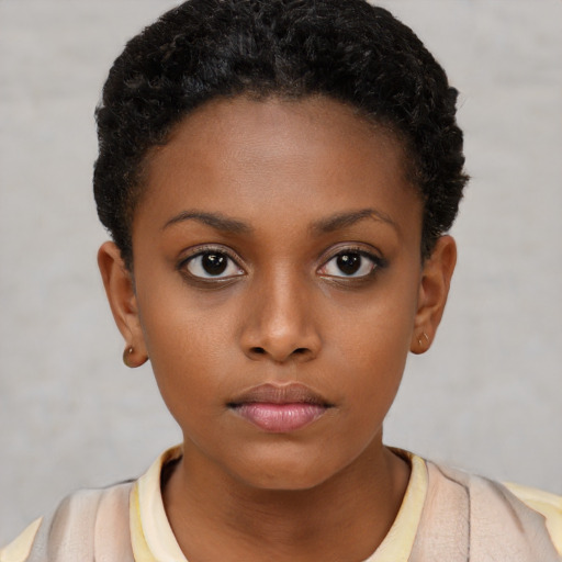 Neutral black child female with short  brown hair and brown eyes