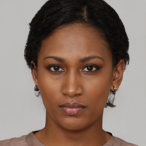 Neutral black young-adult female with short  black hair and brown eyes