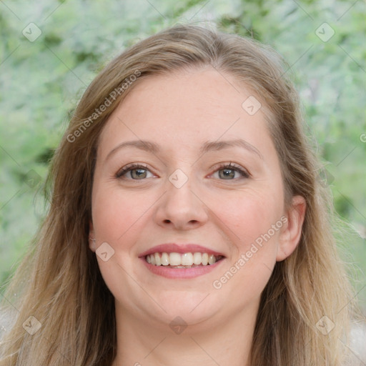 Joyful white young-adult female with long  brown hair and green eyes