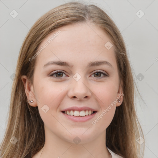 Joyful white young-adult female with long  brown hair and grey eyes