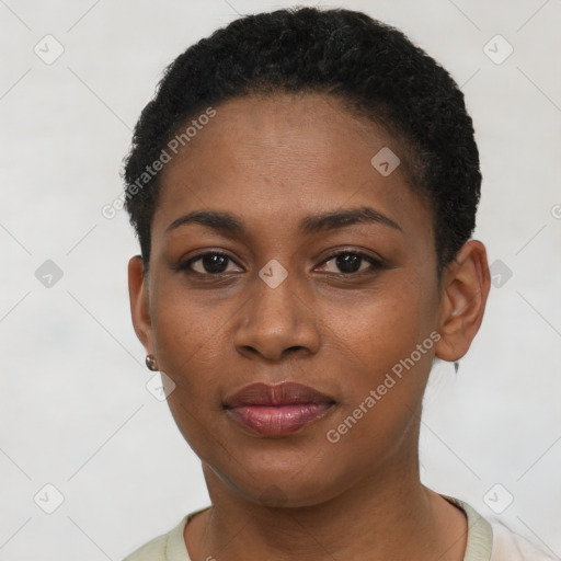 Joyful black young-adult female with short  brown hair and brown eyes