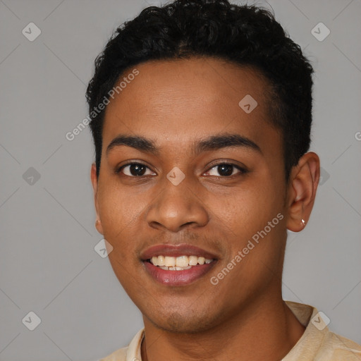 Joyful black young-adult male with short  black hair and brown eyes